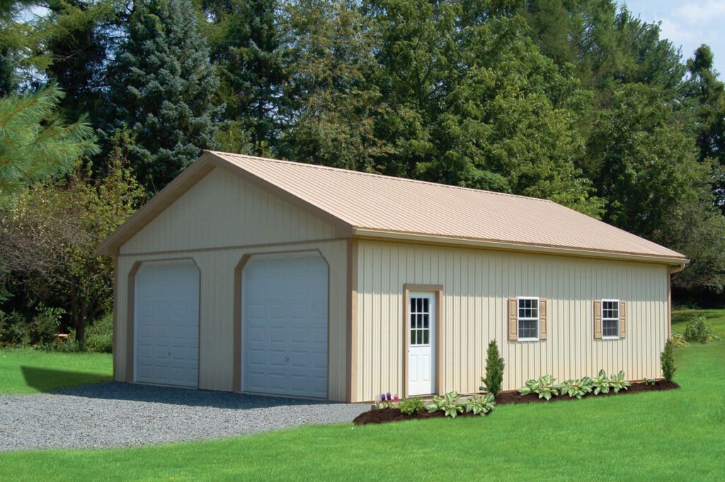 beige pole barn garage with two garage doors